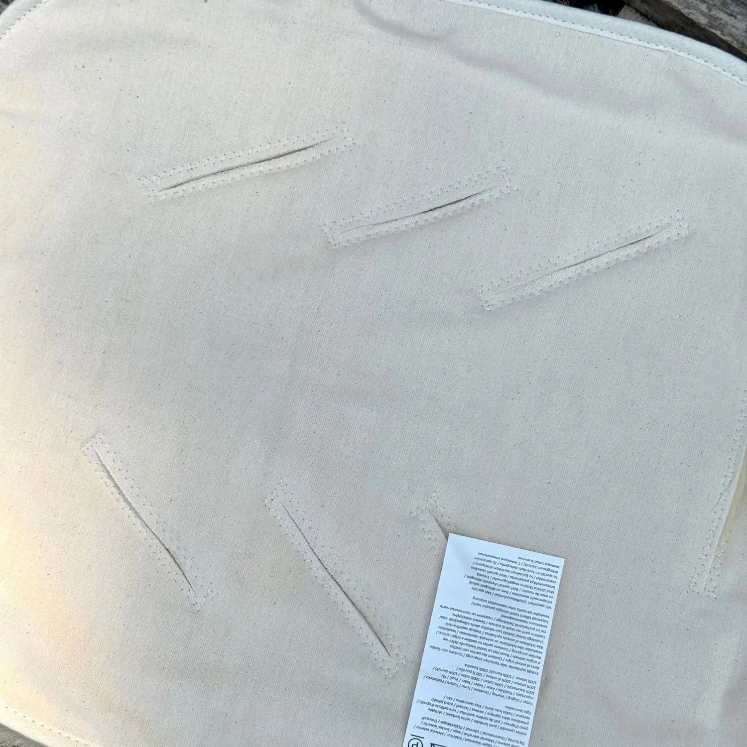 Assise en peau d'agneau Deluxe pour poussette et siège auto Kaiser - face arrière