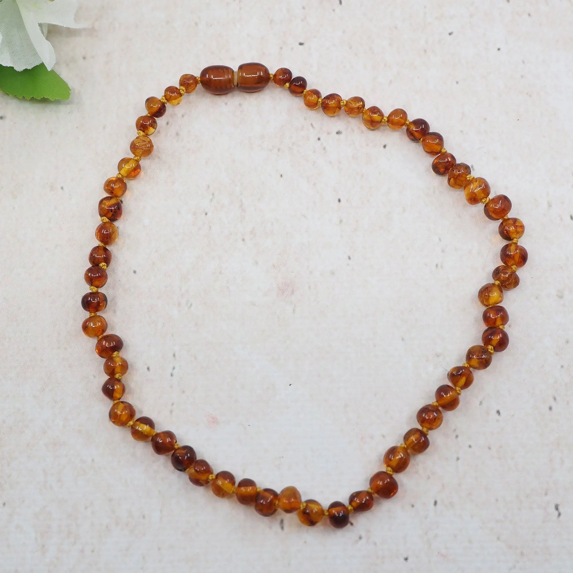 Collier d'ambre pour bébé - Baroque Cognac