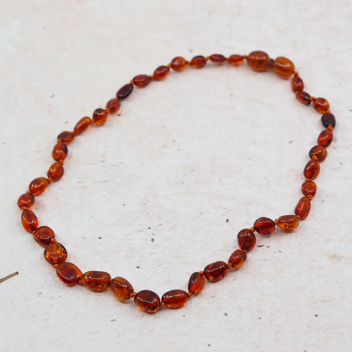 Collier d'ambre pour bébé Olive Cognac