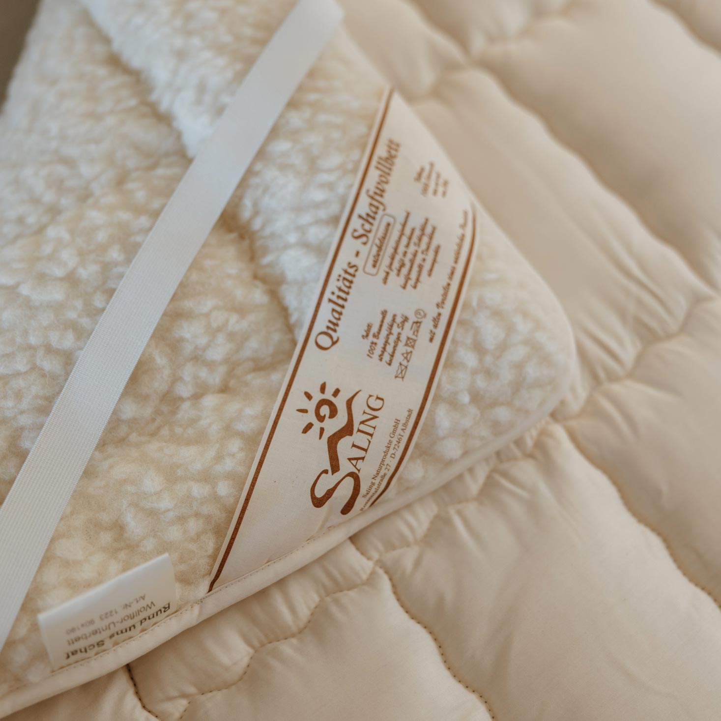 Surmatelas en laine de mouton mérinos Saling - 90×190cm - Lilinappy