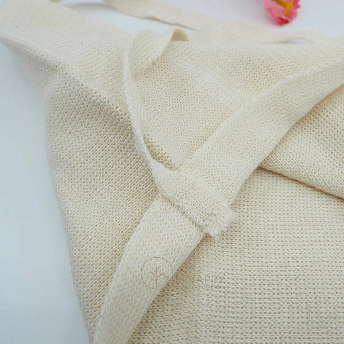 Lien à coudre sur le lange à nouer