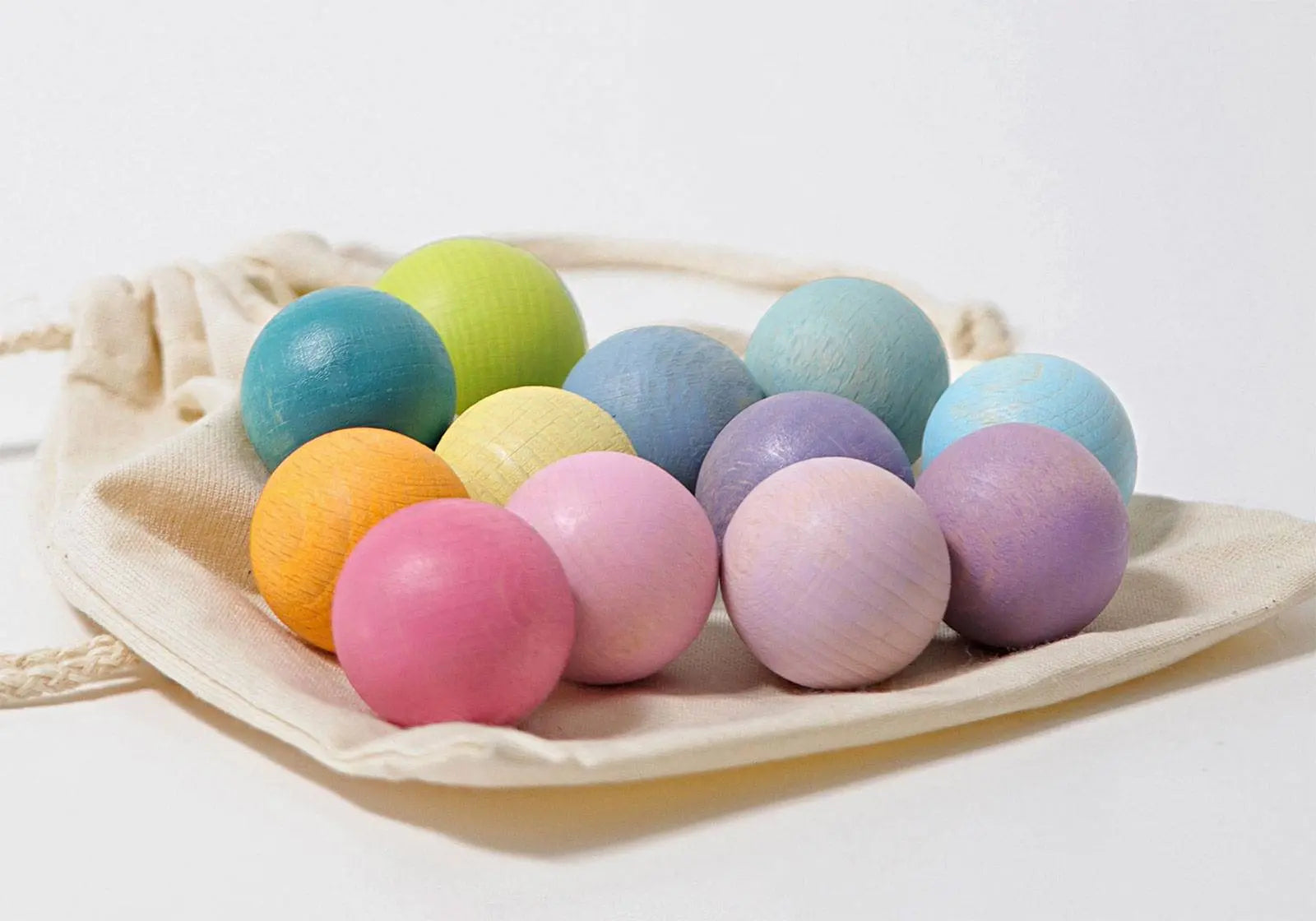 12 petites boules en bois Grimm's - Pastel