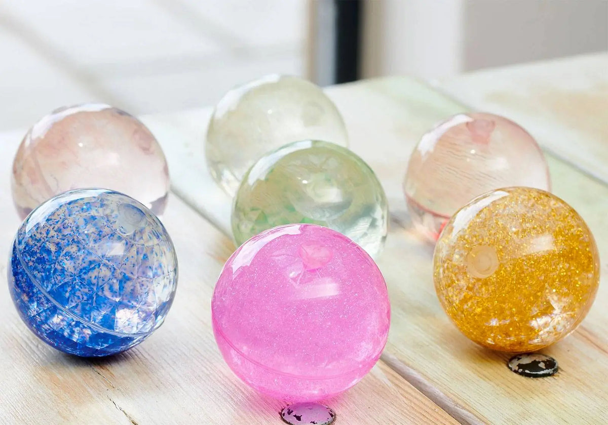 Lot de 7 balles sensorielles à paillettes Tickit